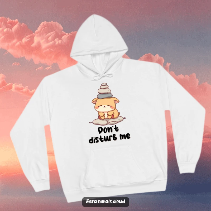 Funny sleepy animal hoodie showing a weary creature precariously balancing a stack of small rocks, offering comfort and humor.