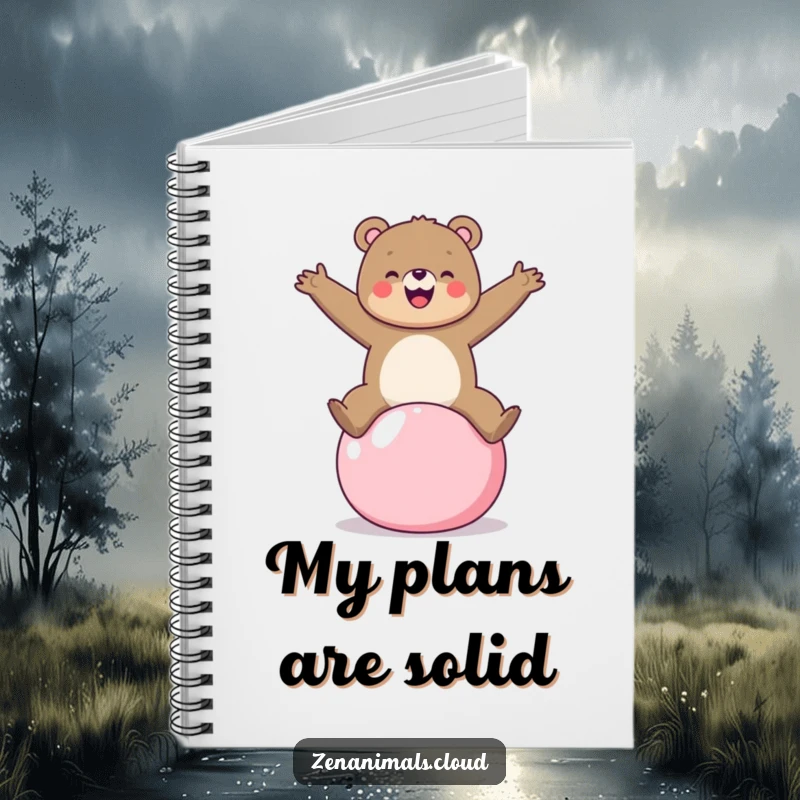Funny bear balancing on a yoga ball on a notebook, ideal for jotting down active thoughts and plans.
